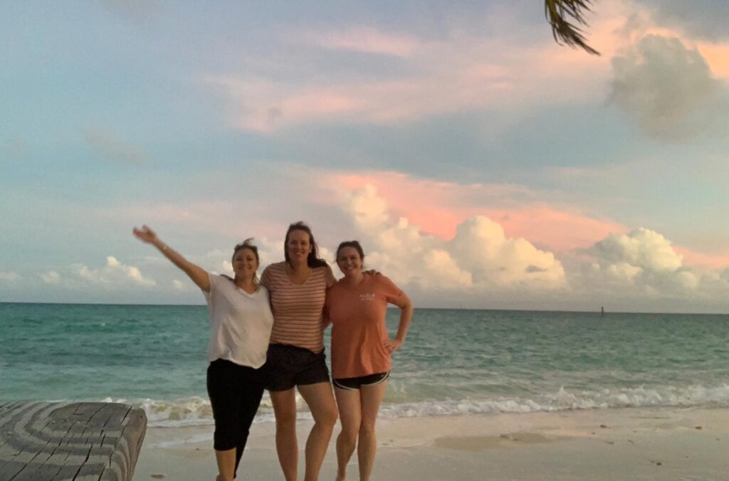 Cara and her team on the beach in the Bahamas
