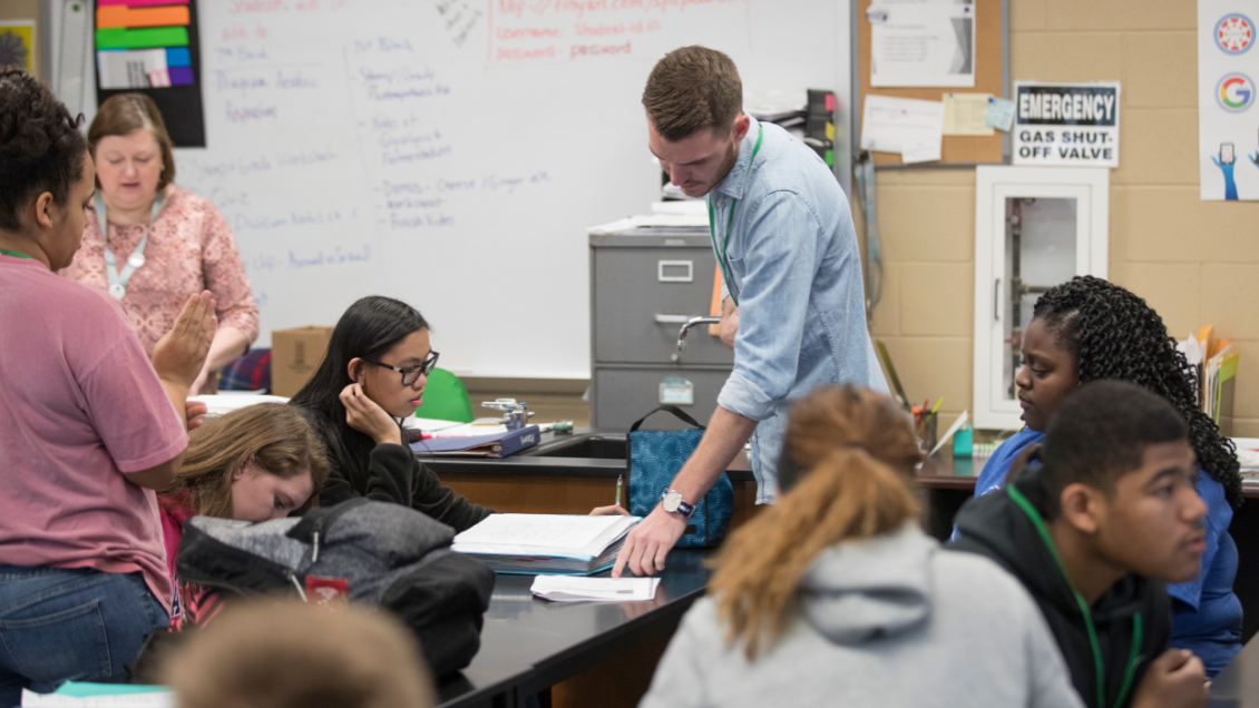 A Missouri State practicum student visits with high-schoolers in this 2017 photo. 
