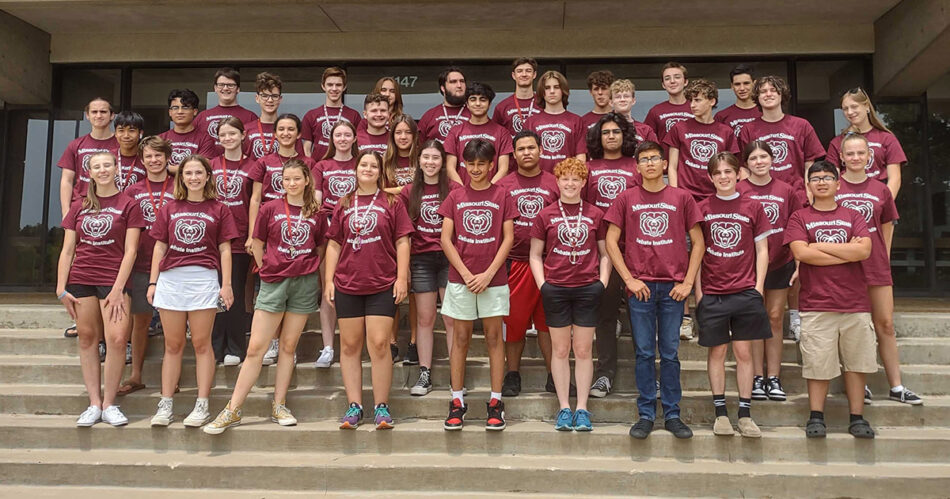 Group of debate camp students pose for photo on steps of Craig Hall at Missouri State University