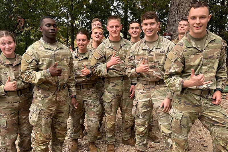 Group of military personnel smiling for camera