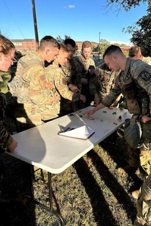 Military individuals outside planning navigation