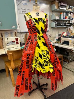 Costume dress made of caution tape