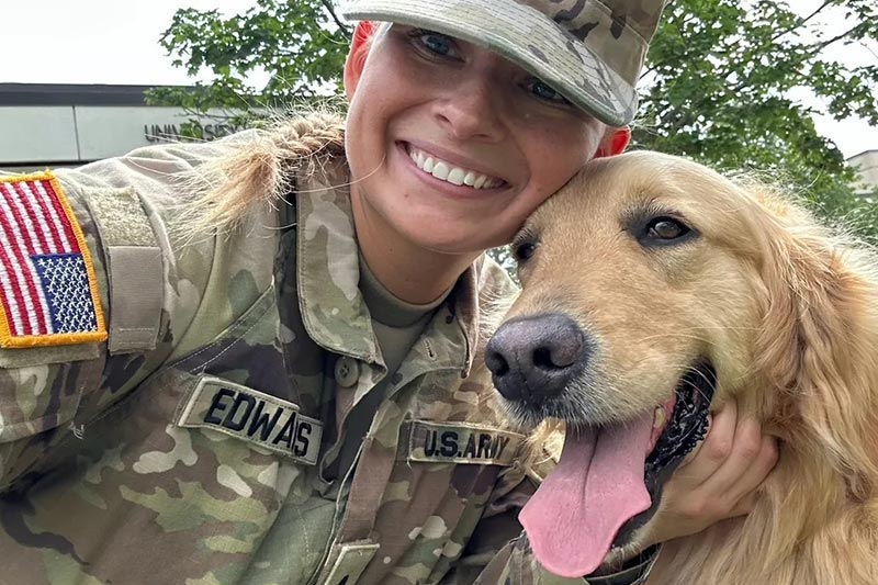 Military woman with dog