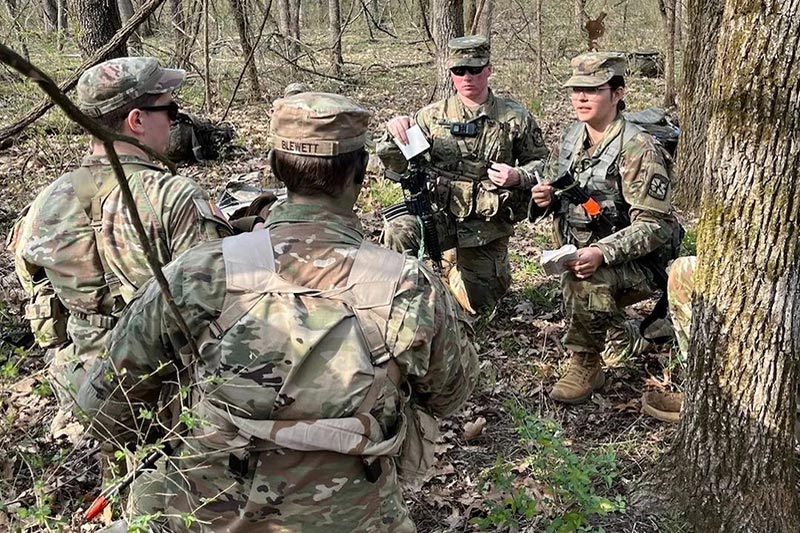 Military personnel in woods