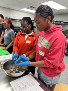 Students making protein balls. 