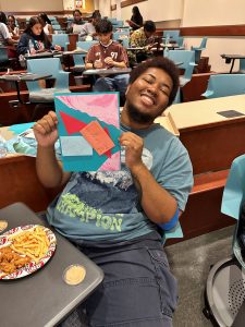 Student holding up their vision board