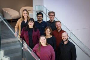 A group photo of the inaugural cohort: Clara Dickinson, Jeff Loughary (front row, left to right), Nichole Ferry, Kelly Dudley, Dr. William Harwood (middle row, left to right), Stephanie Urich, Dr. Asif Ishtiaque and Dr. Benjamin Beranek (back row, left to right).