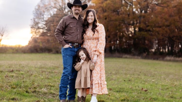 A photo of Nathan and Taylor Isakson with their daughter Korbett Paige.