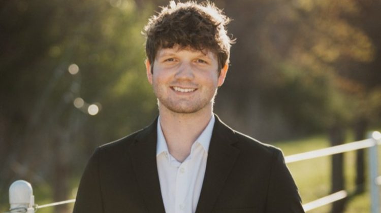 A portrait of Braxton Bishop smiling at the camera.
