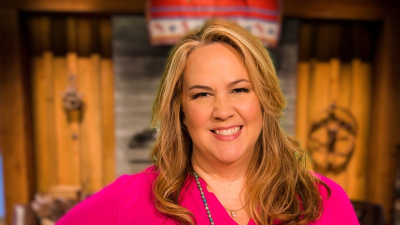 A photo of Janet Adkison smiling.