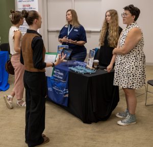 Wonders of Wildlife representatives with students.