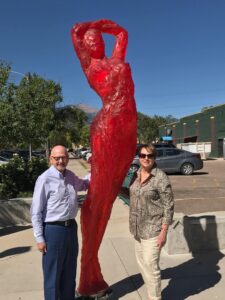 Margaret & Robert Carolla pose in front of a sculpture in the Sculpture Walk Springfield 2016-2017 Collection