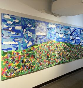 A colorful mural piece by Jeff Moore's 5th grade students