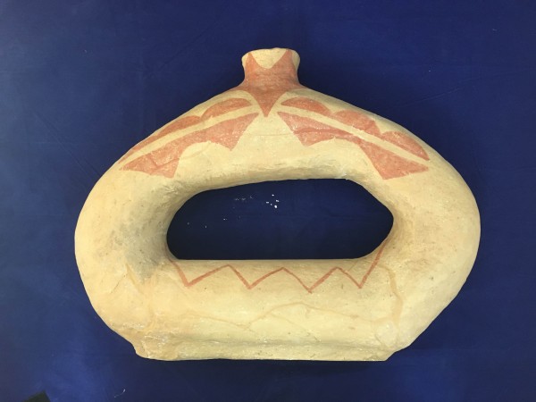 Light Brown Ring-shaped Vessel with Geometric Designs Hisatsinom (Ancestral Puebloan) 1-1250 C.E. Ceramic and pigment, L. 42 cm x W. 11.5 cm x H. 32.2 cm Ralph Foster Museum collection #NN2014.1