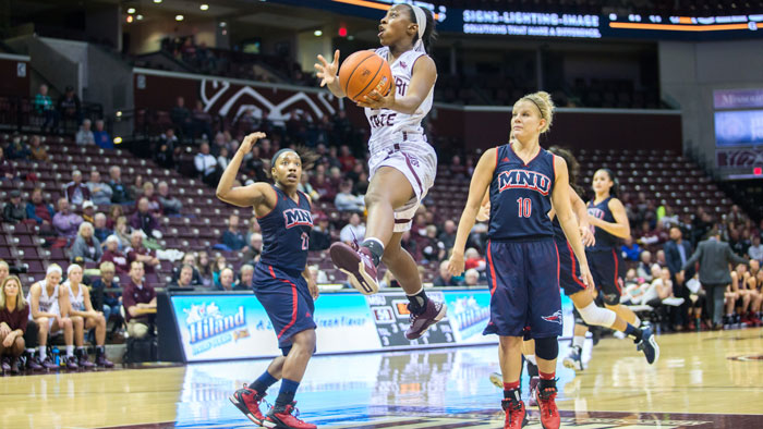 Lady Bears player drives for layup