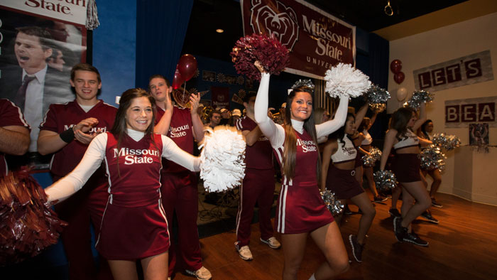 Cheerleaders celebrate at the Hangout during MVC Tournament