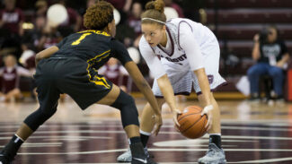 Lady Bears player stares down defender