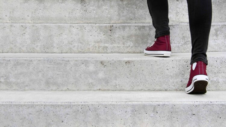 Student walking up steps