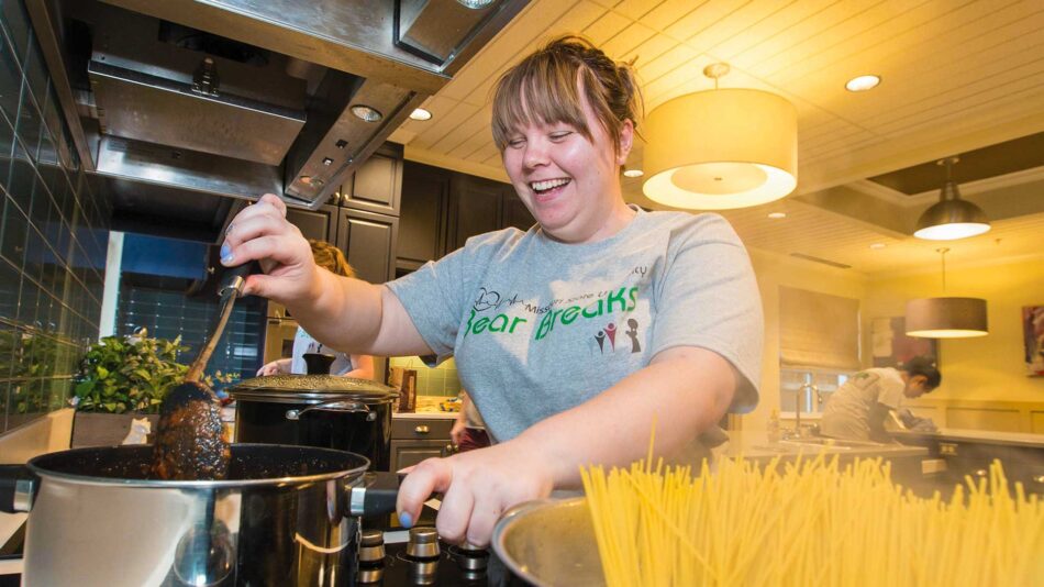 MSU student Nicole Bates stirs spaghetti