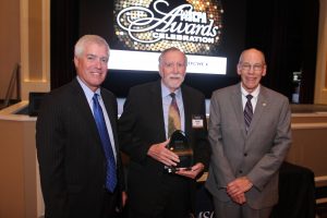 Michael Hammond, center, receives his Outstanding Educator Award from Jim O’Hallaron, President & CEO of the Missouri Society of Certified Public Accountants, pictured left, and John Lindbloom, Chair of the Missouri Society of Certified Public Accountants, pictured right. 