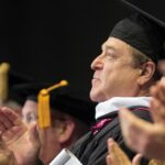 John Goodman clapping during convocation