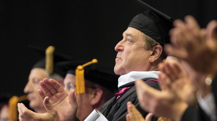 John Goodman clapping during convocation