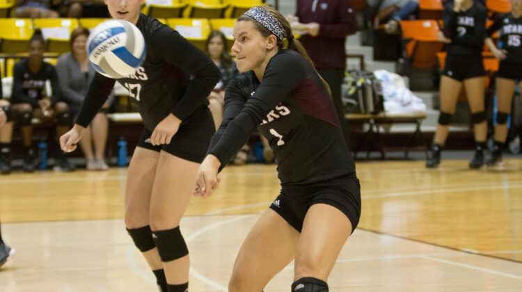 two volleyball players on court