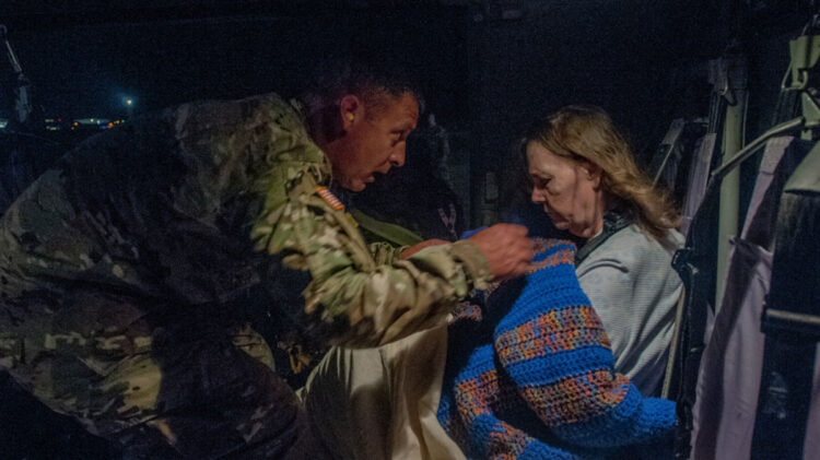 command sergeant assists elderly survivor