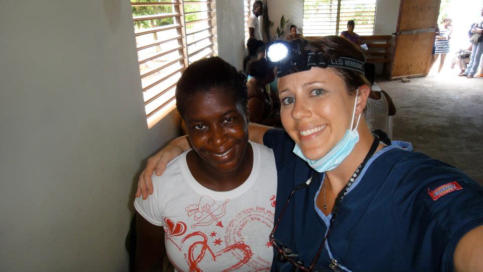Dr. Ellis in Jamaica with a patient