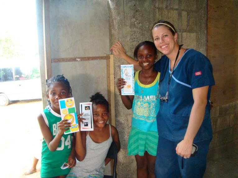 Dr. Ellis in Jamaica with kids she helped