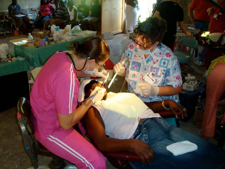 Dr. Ellis in Jamaica working on a patient