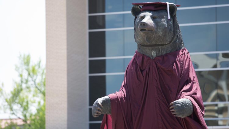 PSU Bear draped in graduation gown