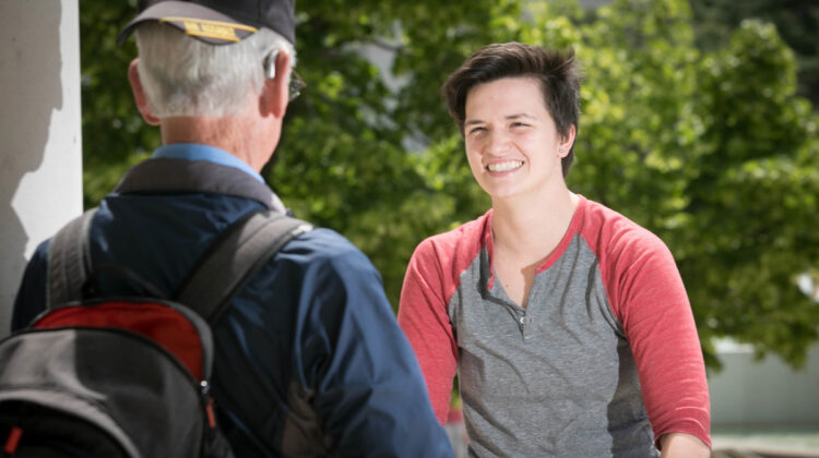 Deidre shaking hands with veteran