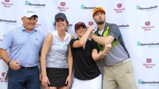 alumni at golf tournament