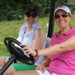 alumni at golf tournament