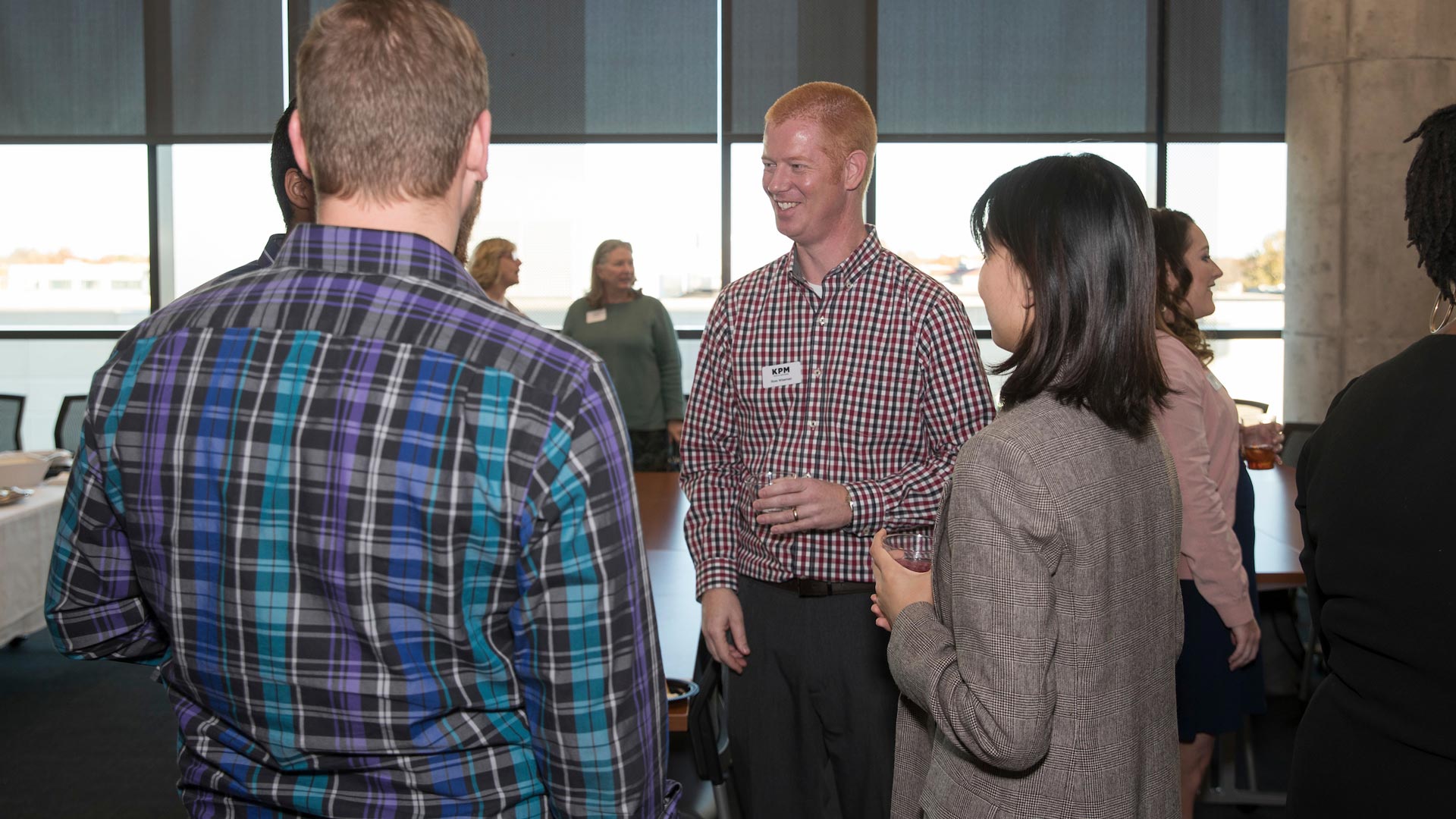 alumni and students talking at networking event