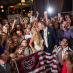 wedding party with Missouri State flag