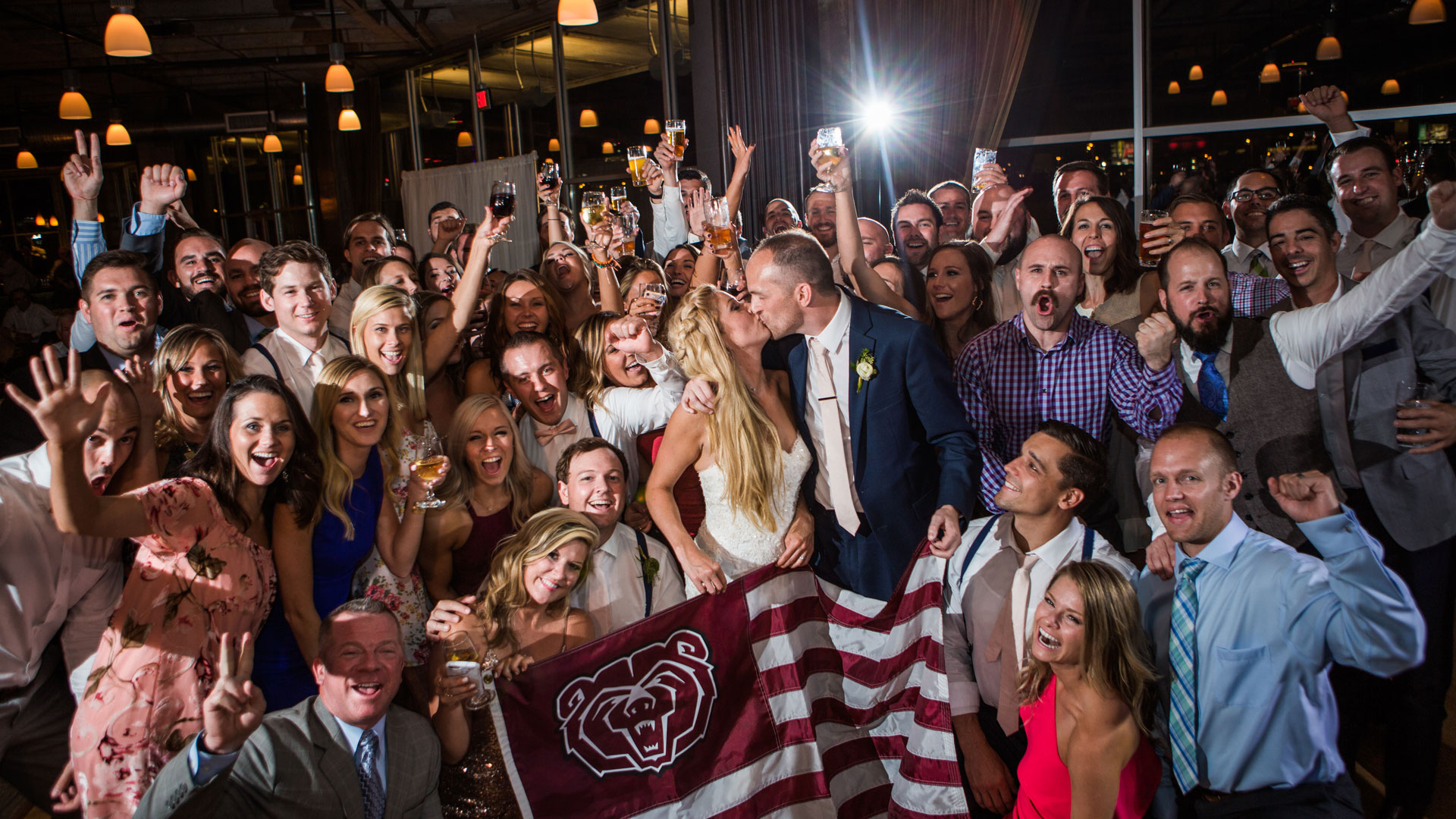 wedding party with Missouri State flag