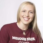 Hannah Harrill wearing Missouri State T-shirt and smiling at camera.