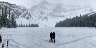 Bethanie and Brad in front of snow-covered mountain