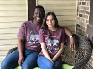 Nii and Rachel pose in their 2017 be a bear shirts