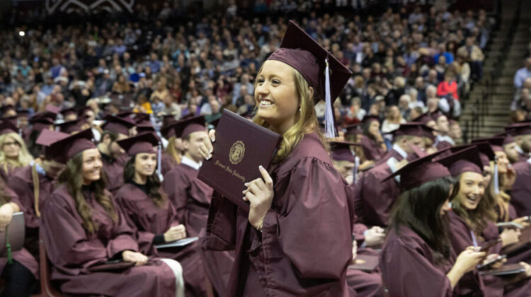 missouri state graduate smiling with diploma