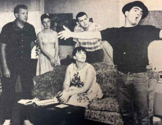 Actors rehearsing in a home.
