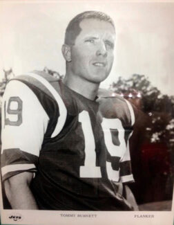 Black and white image of the late Coach Tommy Burnett in his NFL uniform.