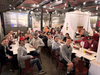 The 2023 MSU handball team at a dinner.
