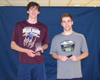 Sam Esser and Max Langmack pose with trophies.