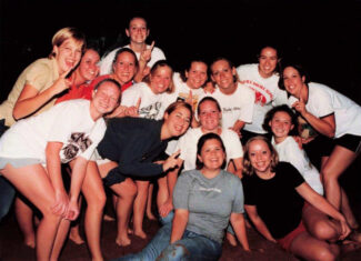 Laura Farmer (back row, sixth from left) celebrates with friends on Alpha Sigma Alpha bid day in fall 2001. She was the philanthropic chair of the sorority. Photo submitted by Laura Farmer.