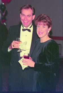 Image of Brent and Jennifer Dunn smiling and holding drinks at a formal event.