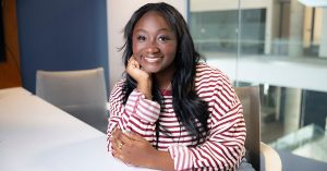 Kamryn Middleton seated a table in Glass Hall.