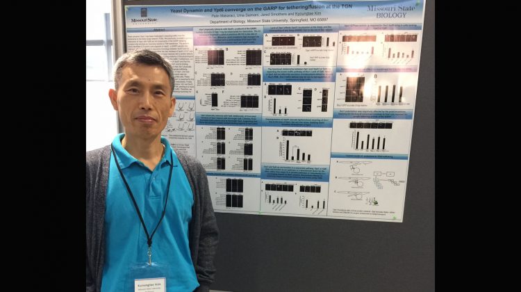 Dr. Kim with his poster